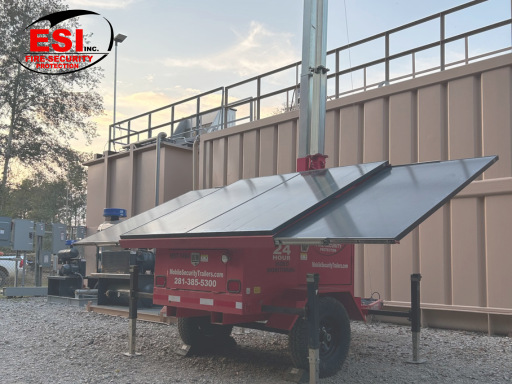 Protecting Critical Infrastructure in Texas with a mobile security trailer deployed at a utility substation fence line at dusk