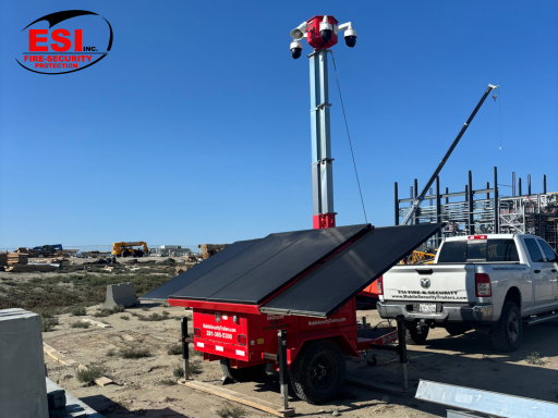 A solar-powered ESI Mobile Security Trailer monitoring a construction site, providing 24/7 surveillance and improving Construction Site Security During the Holidays.